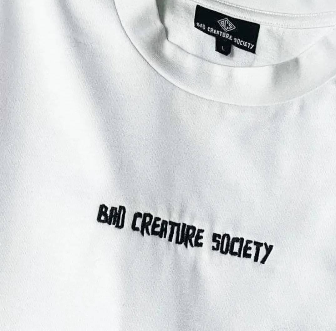 'Bad Creature Society' Minimal T-Shirt - White