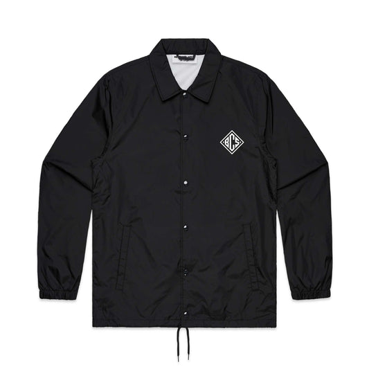 Black coach jacket with a logo on the chest against a white background